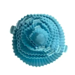 Set 6 moldes circulares azules para freidora de aire con borde ondulado.