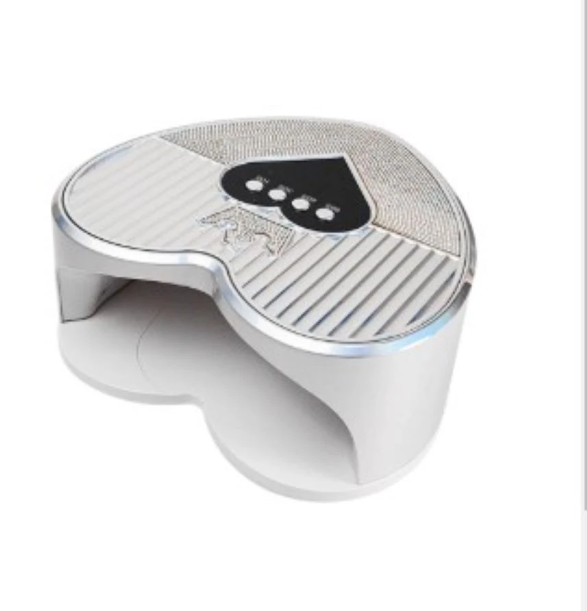 Lámpara de uñas UV LED profesional plateada en forma de corazón, con panel superior texturizado, botones de control integrados y base abierta.