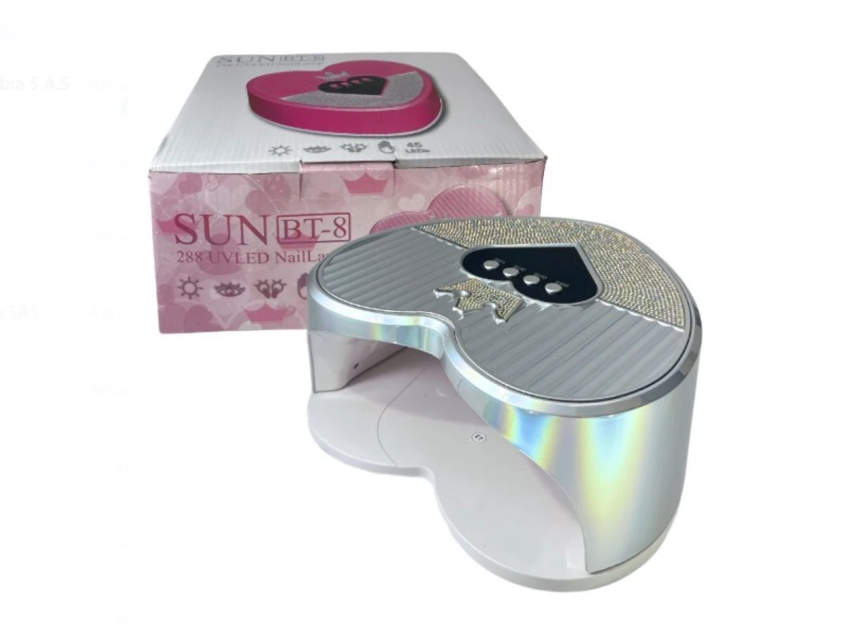 Lámpara UV LED profesional SUN BT-8 de 288W color plateado tornasol con diseño de corazón, cristales decorativos, corona y caja de empaque rosada.