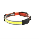 Linterna frontal con banda naranja y negra con logo HEAD, luz LED blanca lineal.