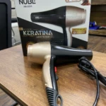 Secador de cabello Nube NB-2003 color dorado y negro con tecnología de keratina y 3000W de potencia.