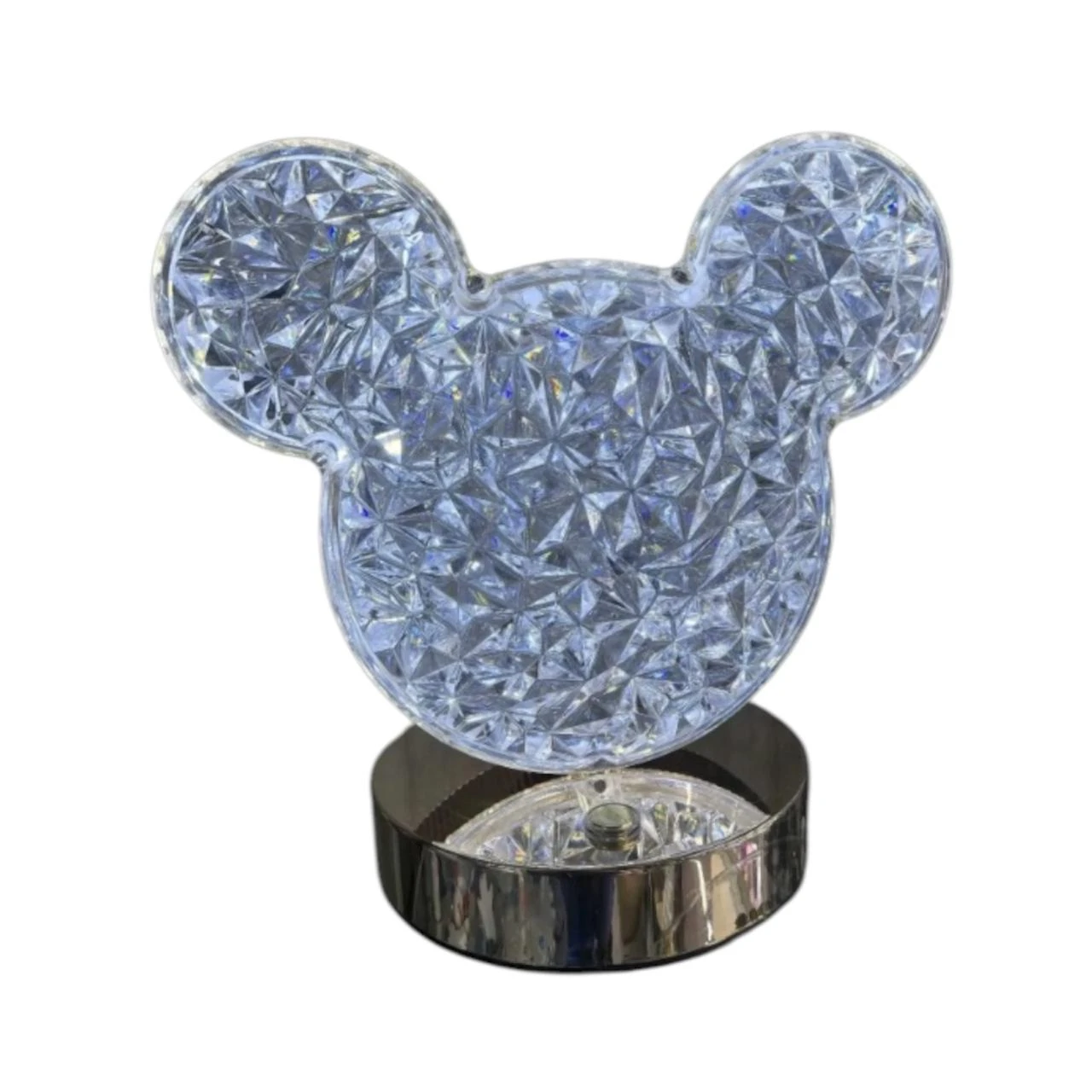 Lámpara LED de mesa con figura de cabeza de ratón en cristal facetado transparente, base metálica plateada brillante.