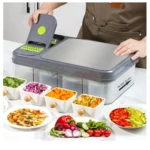 Picador de verduras mandolina gris con compartimentos transparentes y múltiples accesorios.