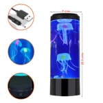 Lámpara LED cilíndrica de 25,5 x 9 cm con dos medusas artificiales en agua azul, incluye cable de alimentación USB y base con botón de encendido.