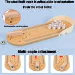 Mini juego de bolos de mesa de madera con pista ajustable y bola metálica.