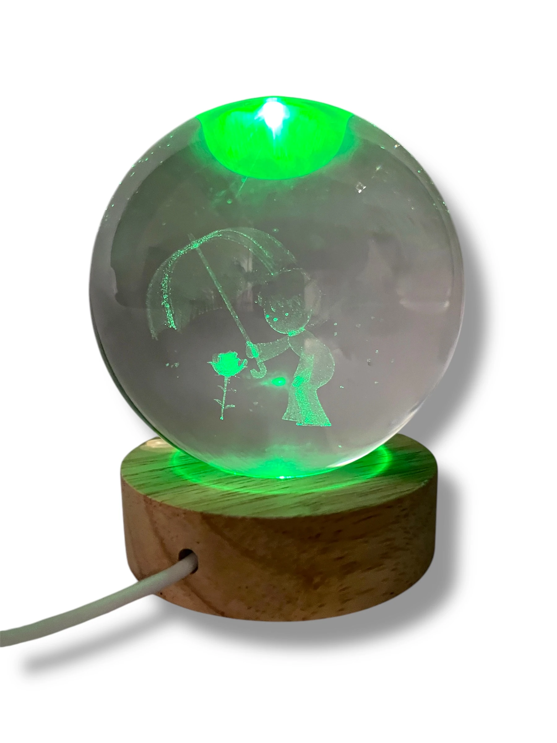Lámpara globo de cristal The Little Prince con grabados, luz verde y base de madera.