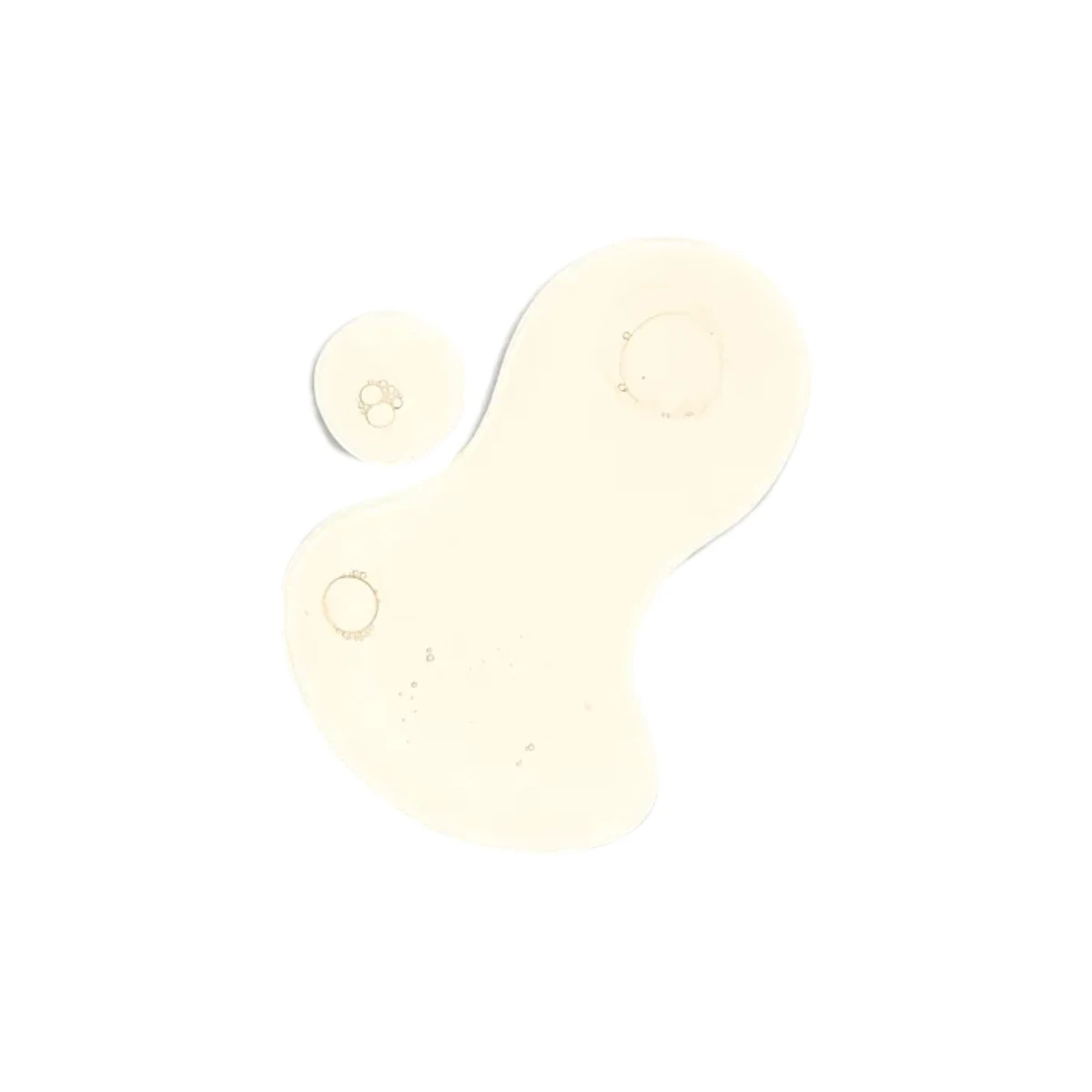 Tónico capilar con gotas amarillas y burbujas, fondo blanco.