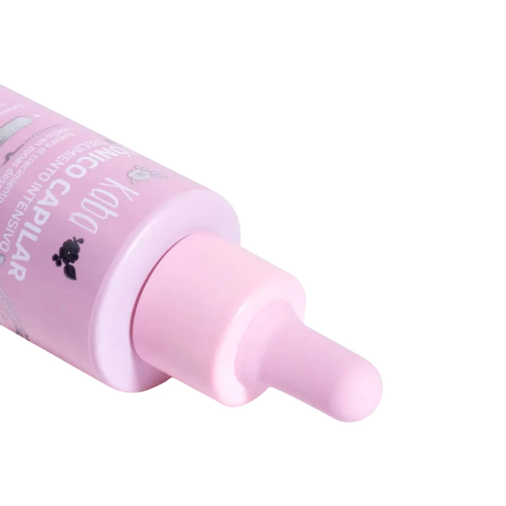 Tónico capilar Kab con aplicador gotero rosa, promueve crecimiento y reduce caída.