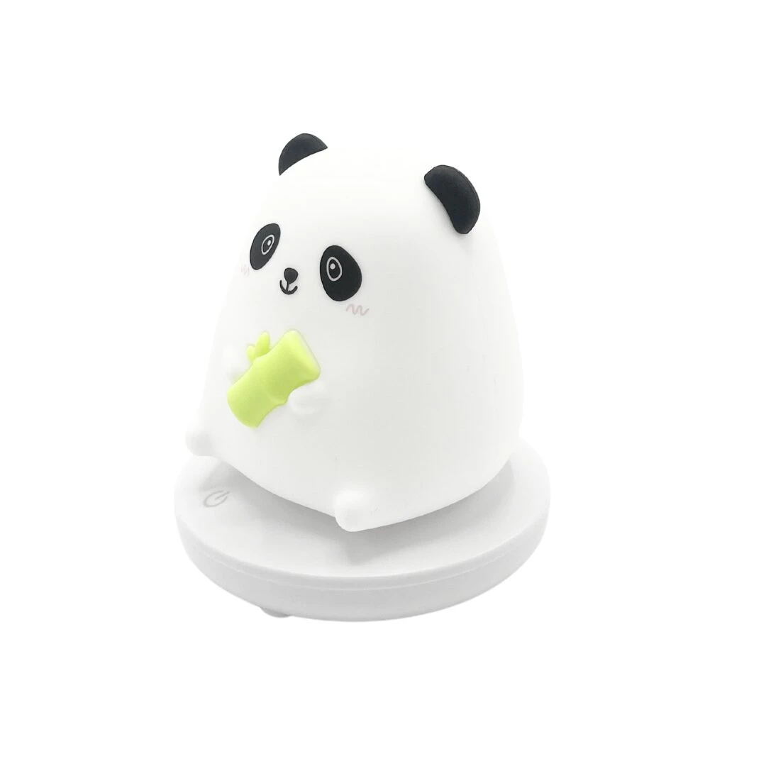 Lampara siliconada animada de panda blanco comiendo bambú verde, con base redonda.