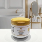 Tarro de 300ml de tratamiento capilar Haumea de células madre con tapa amarilla sobre base blanca, en un ambiente de baño con espejo de fondo.