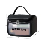 Bolso cosmetiquera negra "Wash Bag" transparente, 23x16x14cm, con asa y doble cierre de corazón.