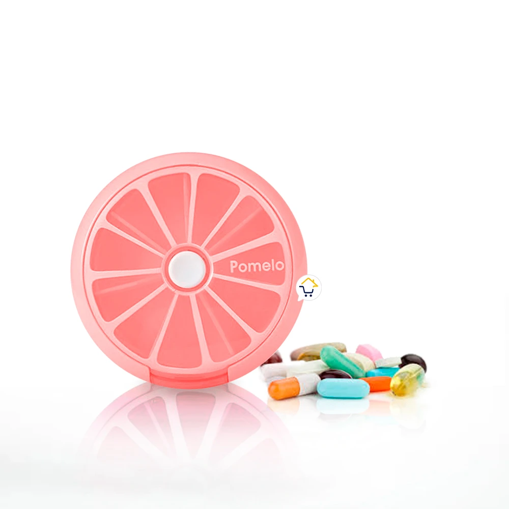 Pastillero semanal rosa con forma de pomelo, con 7 compartimentos y píldoras de colores.