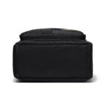 Base de bolso de seguridad negro de nylon para dama y niña, vista inferior, textura tejida.