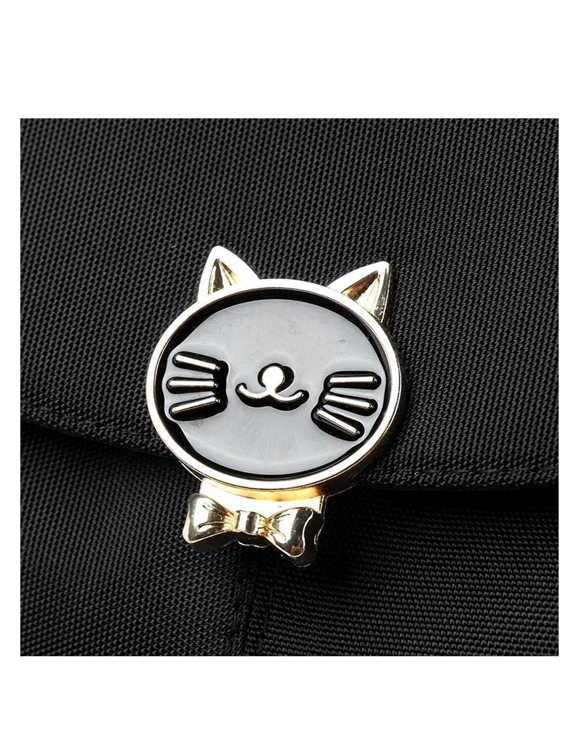 Pin metálico dorado y negro con diseño de gato y moño, adorno para bolso de dama o niña.