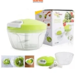 Picador manual de verduras verde y transparente, incluye cuchillas, con caja y varias imágenes de uso y resultado.