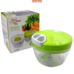 Picador de verduras manual verde y transparente, modelo Nicer Dicer Plus Speedy Chopper, para uso en cocina.