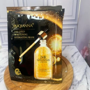 Mascarilla facial hidratante 24k Gold Pufianna con ampolla dorada y gotas de oro.