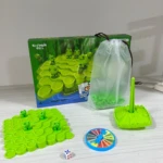 Juego de mesa de equilibrio con ranas verdes, base de árbol, ruleta y dado.