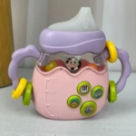 Rascaencias tetero rosado con asas moradas, sonajero y botones interactivos de música y animales.