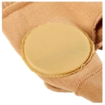 Corrector de juanetes beige con almohadilla circular para alivio del dolor y presión en el pie.