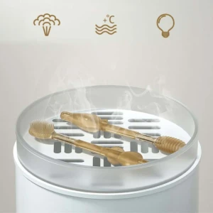 Cepillo de silicona para bebé en vaporizador con símbolos de temperatura y bombilla.