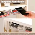 Cajones organizadores transparentes bajo escritorio, uno sujetando un smartphone y otro mostrando cargador.