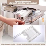 Cajón organizador transparente deslizable para escritorio con calculadora y artículos de oficina.