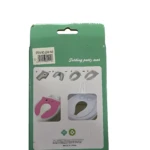 Empaque verde con instructivo plegable de asiento reductor de inodoro portátil infantil. Muestra versión rosa y blanca.