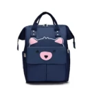 Morral panalera azul marino para bebé con diseño de osito frontal.