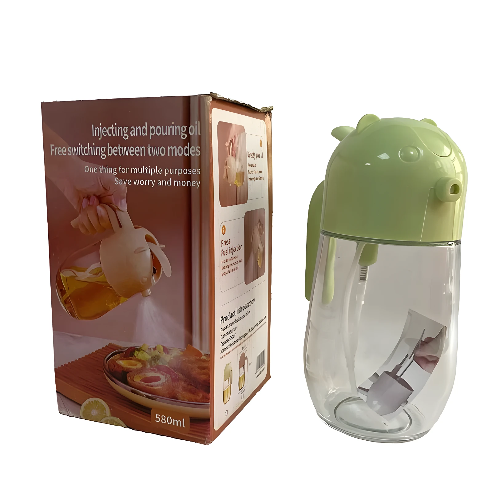 Dispensador de aceite 580ml, tapa verde con diseño animal, junto a su caja que muestra modos de vertido y atomización.