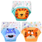 Tres calzones entrenadores para bebé con diseño de animales: león, hipopótamo azul y tigre naranja, fondo blanco con dibujos infantiles.