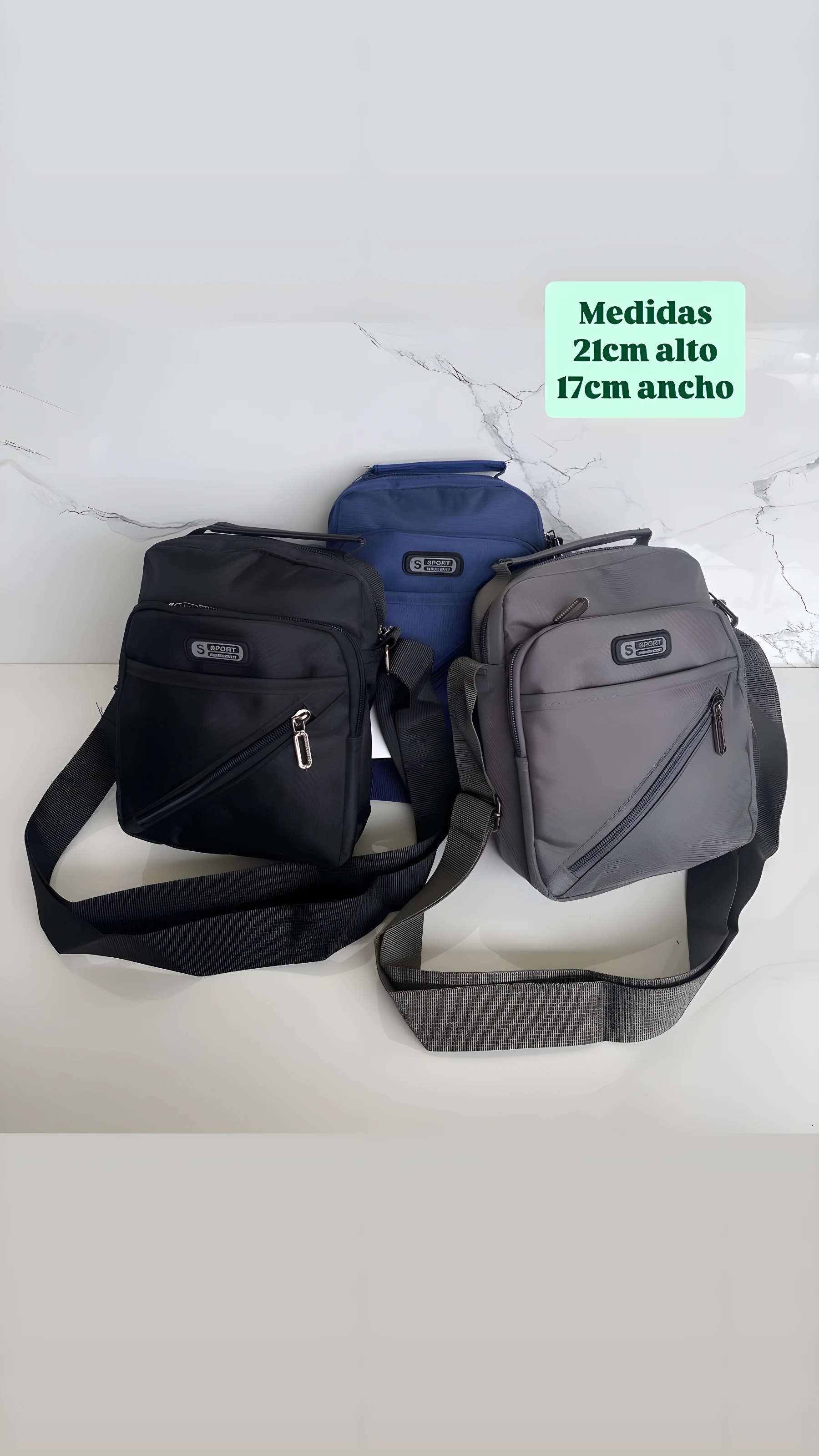 Tres carriel sport en nylon, colores negro, azul oscuro y gris, exhibidos con medidas: 21cm alto y 17cm ancho.