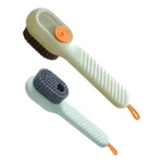 Dos cepillos limpiadores de calzado con cerdas grises: uno verde claro con dispensador de jabón y botón naranja, el otro verde menta.