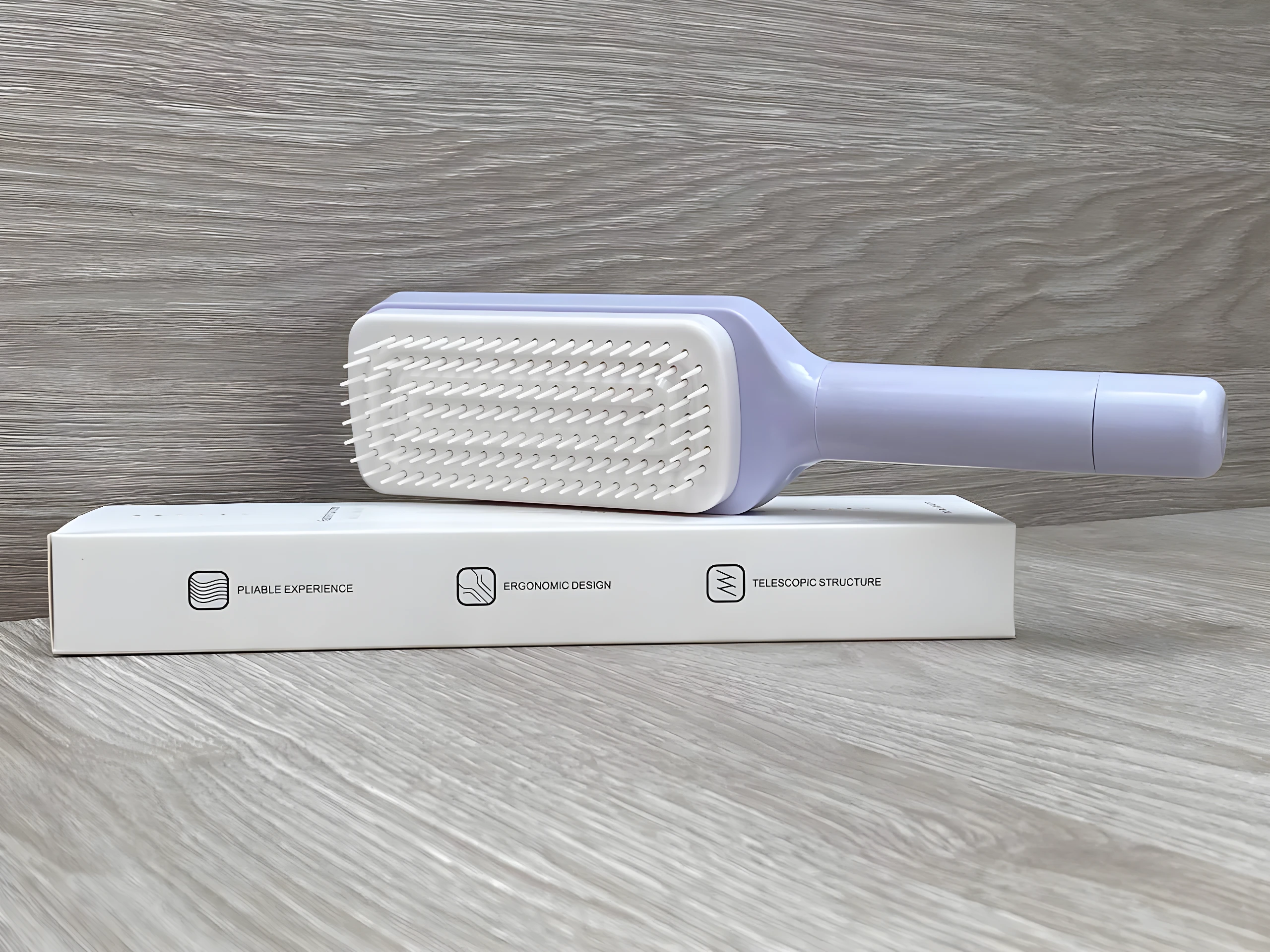 Cepillo peine retráctil de limpieza automática, color lila, para desenredar cabello.