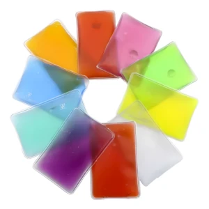 Cojines de gel reutilizables multicromáticos (naranja, rosa, verde, amarillo, morado, etc.) dispuestos en círculo para uso frío/caliente.