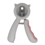 Cortaúñas para mascotas blanco con detalles rosados, diseño ergonómico de cabeza redonda con orejas de gato y resorte visible.