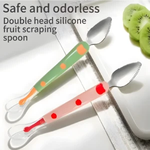Dos cucharas rascadoras de fruta doble cabeza: mango verde con puntos naranja y mango rosa con puntos rojos, y punta de silicona.