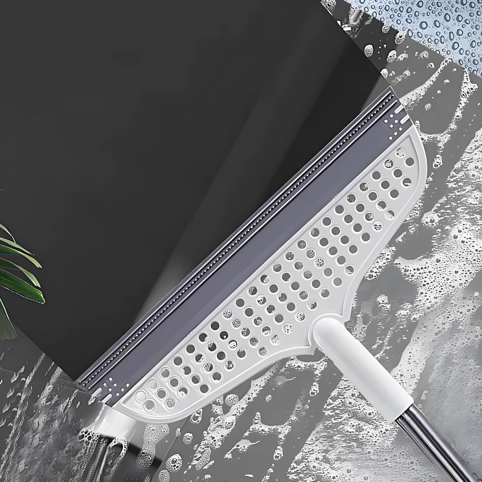 Escoba raspador de silicona gris y blanca para pisos lisos, quitando agua y residuos.
