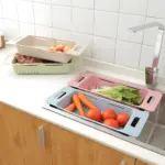 Escurridores telescópicos para fregadero, colores verde, beige, azul y rosa, con frutas y verduras.