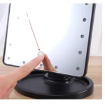 Espejo de maquillaje cuadrado negro con luces LED, tocado por dedo.