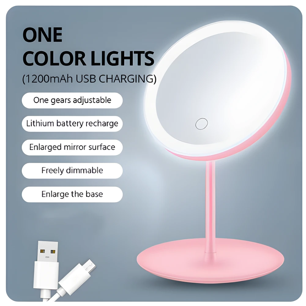 Espejo de maquillaje rosa con luz LED circular, base ancha y USB recargable.