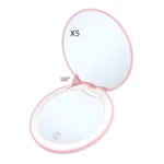 Espejo compacto plegable rosa con luz LED, apertura 180° y aumento X5.