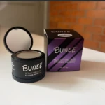 Set x2 Fibras Capilares Bunee Dark Brown, para retocar canas y calvicie al instante en envase negro con espejo y caja morada.