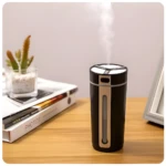 Humidificador portátil negro emitiendo vapor, ideal para coche y oficina, con ventana visible de nivel.