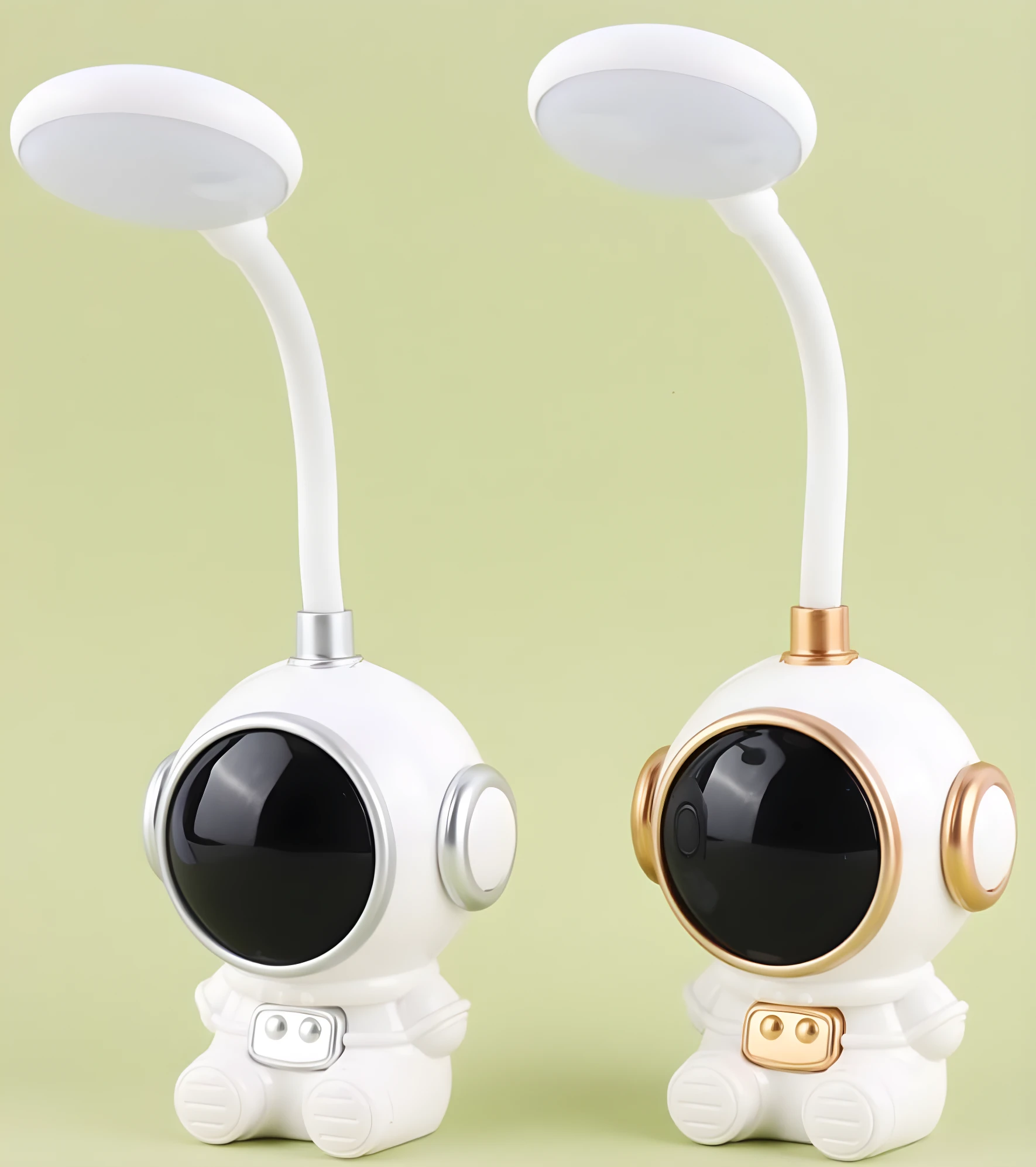 Dos lámparas de escritorio LED flexibles con base en forma de astronauta blanco, una con detalles plateados y otra con detalles dorados.
