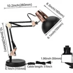 Lámpara Pixar articulada negra con detalles en cobre, incluye base circular de 155mm, prensa de sujeción, cable de 51 pulgadas y medidas detalladas.