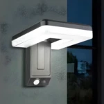 Lámpara solar LED exterior gris, impermeable, con sensor de movimiento, ilumina muros y ventanas.