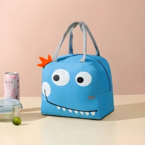 Lonchera térmica infantil azul con divertido diseño de monstruo, ideal para mantener alimentos fríos o calientes en el colegio.
