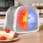 Lonchera térmica plateada de 3 capas con diseño dividido fuego y hielo, ideal para conservar alimentos fríos o calientes.