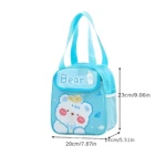 Lonchera térmica azul con diseño de oso y vaso, 20x14x23cm, ideal para mantener alimentos fríos o calientes.